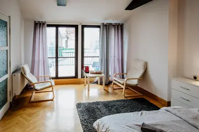 Łóżko lub łóżka w pokoju w obiekcie Green Wood Apartament Stara Ochota