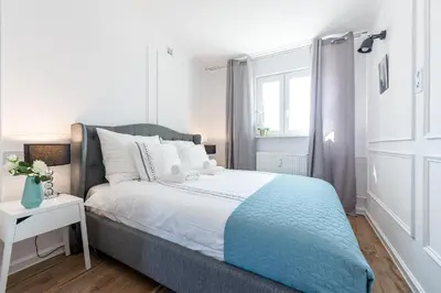 Łóżko lub łóżka w pokoju w obiekcie Poznańska P&O Apartments
