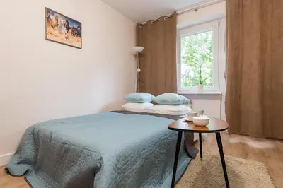 Łóżko lub łóżka w pokoju w obiekcie P&O Apartments Kasprzaka