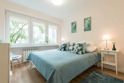 Łóżko lub łóżka w pokoju w obiekcie P&O Apartments Kasprzaka