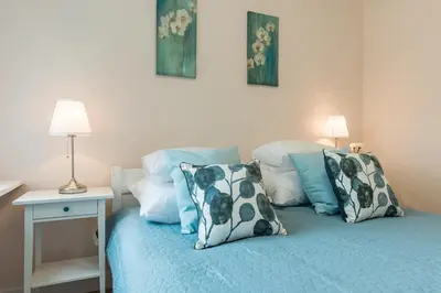 Łóżko lub łóżka w pokoju w obiekcie P&O Apartments Kasprzaka