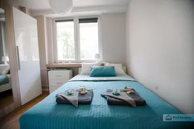 Łóżko lub łóżka w pokoju w obiekcie Warsaw Concierge Polin Apartment