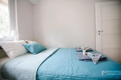 Łóżko lub łóżka w pokoju w obiekcie Warsaw Concierge Polin Apartment