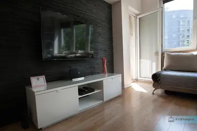 Telewizja i/lub zestaw kina domowego w obiekcie Warsaw Concierge Polin Apartment