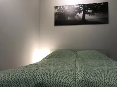 Łóżko lub łóżka w pokoju w obiekcie Szucha Apartments