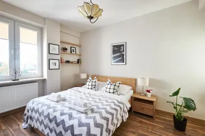 Łóżko lub łóżka w pokoju w obiekcie Noctis Apartment Tamka