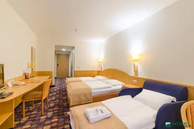 Łóżko lub łóżka w pokoju w obiekcie Hotel Partner