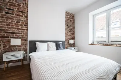 Łóżko lub łóżka w pokoju w obiekcie Apartament Bednarska Old Town