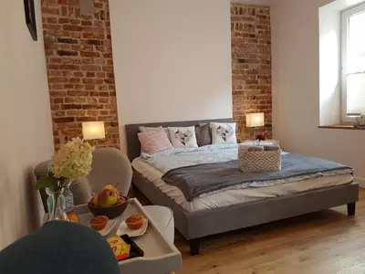 Łóżko lub łóżka w pokoju w obiekcie Apartament Bednarska Old Town