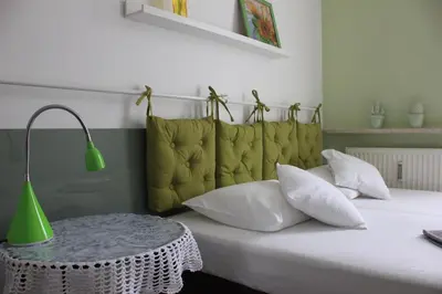 Łóżko lub łóżka w pokoju w obiekcie Kolorowa Guest Rooms
