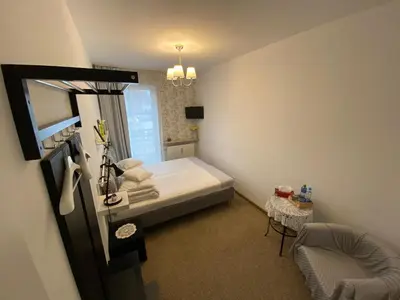 Łóżko lub łóżka w pokoju w obiekcie Kolorowa Guest Rooms