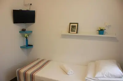 Łóżko lub łóżka w pokoju w obiekcie Kolorowa Guest Rooms