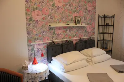 Łóżko lub łóżka w pokoju w obiekcie Kolorowa Guest Rooms