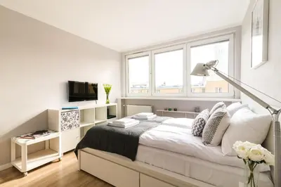 Łóżko lub łóżka w pokoju w obiekcie Bagno 7 - Modern Apartment by Noclegi Renters