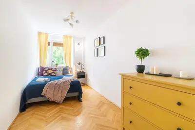 Łóżko lub łóżka w pokoju w obiekcie Warm & Family Friendly Apartment with Balcony by Noclegi Renters
