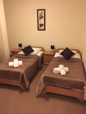 Łóżko lub łóżka w pokoju w obiekcie Hotel Roko