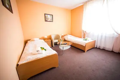 Łóżko lub łóżka w pokoju w obiekcie Hotel Roko