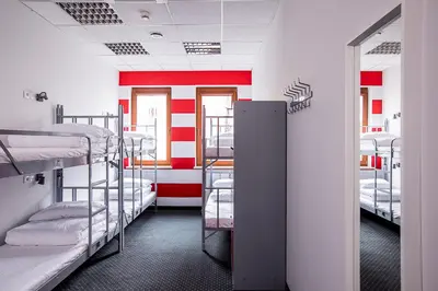Łóżko lub łóżka w pokoju w obiekcie Inbed Hostel