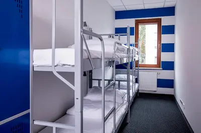 Łóżko lub łóżka w pokoju w obiekcie Inbed Hostel
