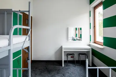 Łóżko lub łóżka w pokoju w obiekcie Inbed Hostel