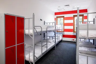 Łóżko lub łóżka w pokoju w obiekcie Inbed Hostel