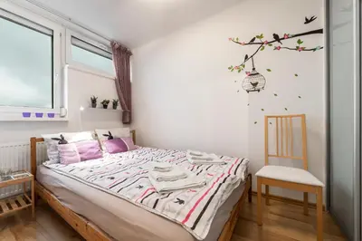 Łóżko lub łóżka w pokoju w obiekcie Apartment Saski Garden Marszalkowska street