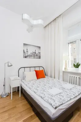Łóżko lub łóżka w pokoju w obiekcie Sawa Apartment