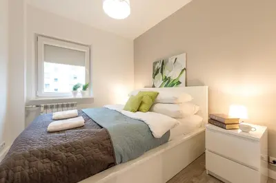 Łóżko lub łóżka w pokoju w obiekcie P&O Apartments Okecie