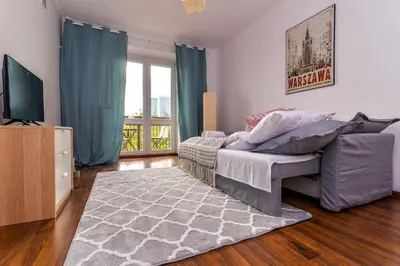 Telewizja i/lub zestaw kina domowego w obiekcie Cozy Apartment with Balcony - Palace of Culture by Rent Like Home