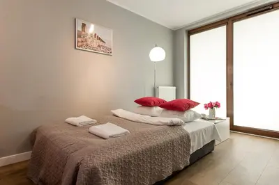 Łóżko lub łóżka w pokoju w obiekcie P&O Apartments Ordona 2