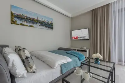 Łóżko lub łóżka w pokoju w obiekcie P&O Apartments Służewiec