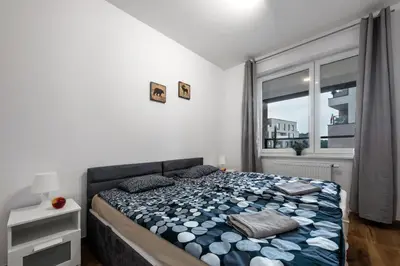 Łóżko lub łóżka w pokoju w obiekcie Waw - Apartamenty Wilanów I