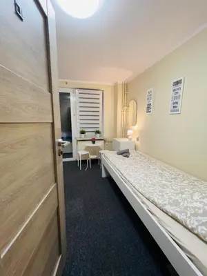 Łóżko lub łóżka w pokoju w obiekcie Apart Rooms City Centre
