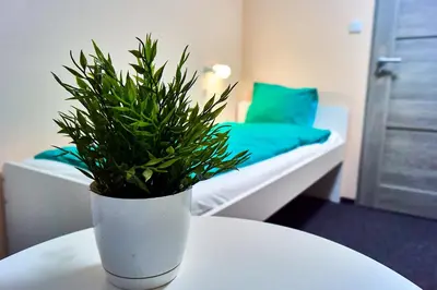 Łóżko lub łóżka w pokoju w obiekcie Apart Rooms City Centre