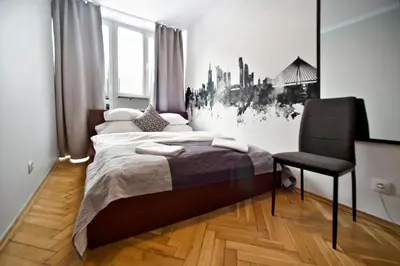 Łóżko lub łóżka w pokoju w obiekcie Hala Mirowska Apartments