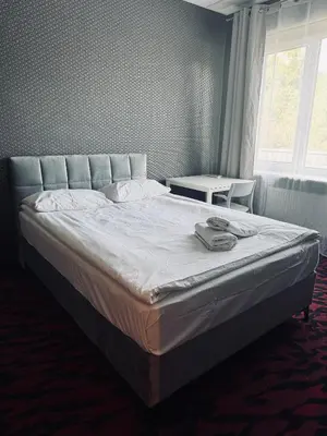 Łóżko lub łóżka w pokoju w obiekcie Loft Car Factory