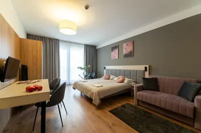 Łóżko lub łóżka w pokoju w obiekcie Apartments 