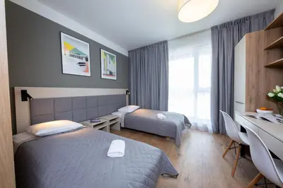 Łóżko lub łóżka w pokoju w obiekcie Apartments 