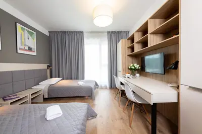 Łóżko lub łóżka w pokoju w obiekcie Apartments 