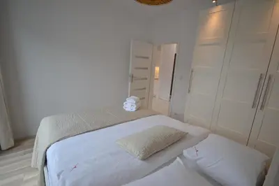 Łóżko lub łóżka w pokoju w obiekcie NotaBene Apartment