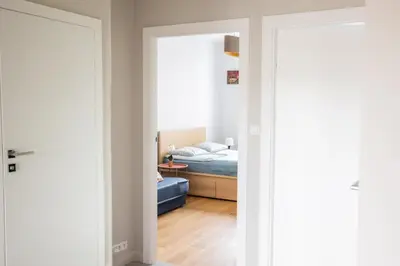 Łóżko lub łóżka w pokoju w obiekcie SuperApart Bobrowiecka 3 - Obok Centrum Olinek