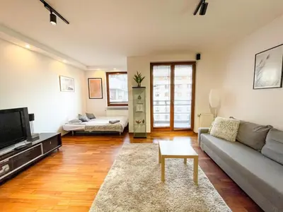 Łóżko lub łóżka w pokoju w obiekcie SuperApart Bobrowiecka 3 - Obok Centrum Olinek