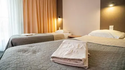 Łóżko lub łóżka w pokoju w obiekcie Hotel Gaja