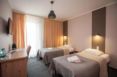 Łóżko lub łóżka w pokoju w obiekcie Hotel Gaja