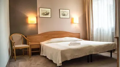 Łóżko lub łóżka w pokoju w obiekcie Hotel Gaja