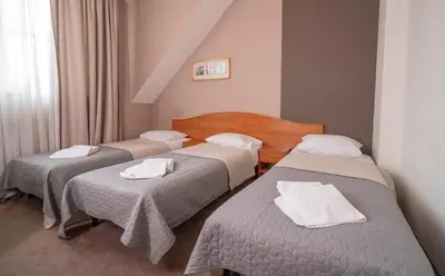 Łóżko lub łóżka w pokoju w obiekcie Hotel Gaja