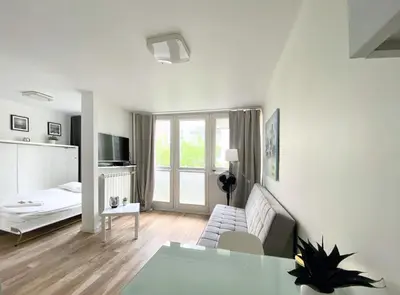 Łóżko lub łóżka w pokoju w obiekcie Warsaw Concierge Rondo ONZ