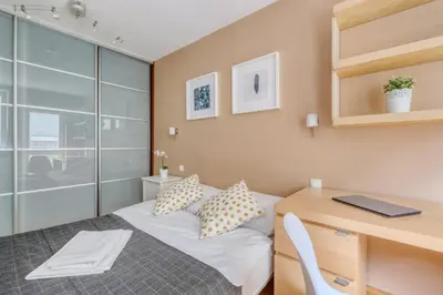 Łóżko lub łóżka w pokoju w obiekcie Noctis Apartment Śliska