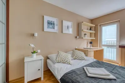 Łóżko lub łóżka w pokoju w obiekcie Noctis Apartment Śliska