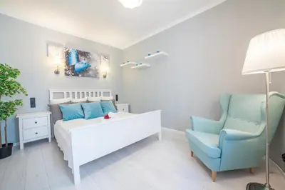 Łóżko lub łóżka w pokoju w obiekcie Apartments Madelaine Warsaw by Noclegi Renters